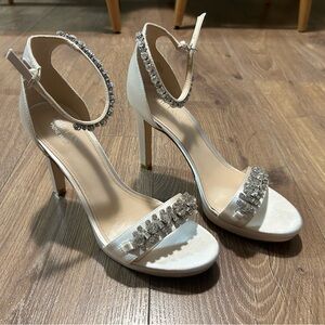 Never worn pair of Nine West Neil Lane heels. Size 10.5. White Satin color.